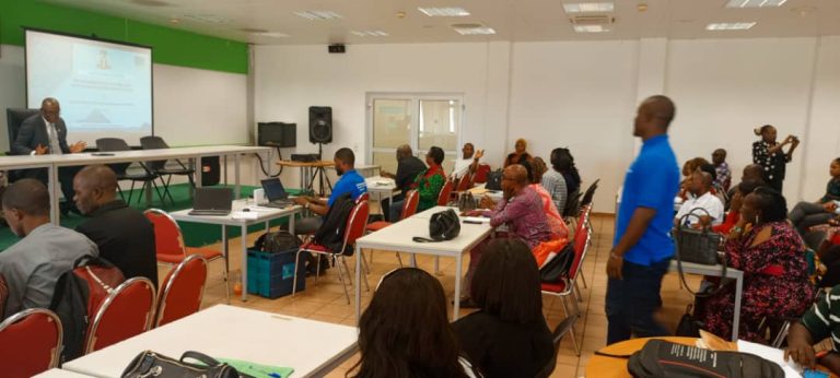 FMSD core team in a hand holding on the use of the Newly developed PMS IT solution with Frandek International Consulting exercise